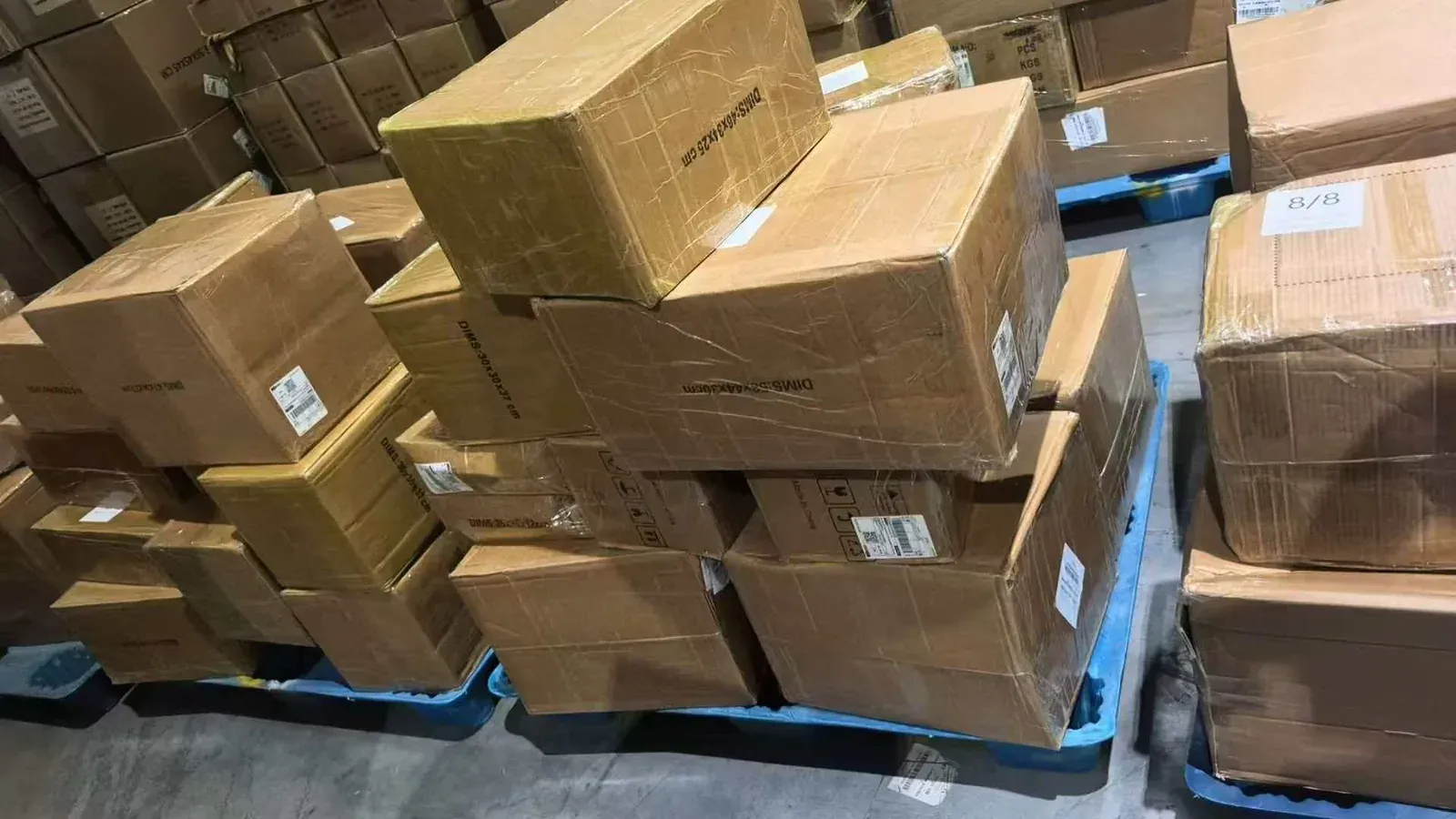 Cartons from a 2000 kg cast iron cookware order prepared for international shipment