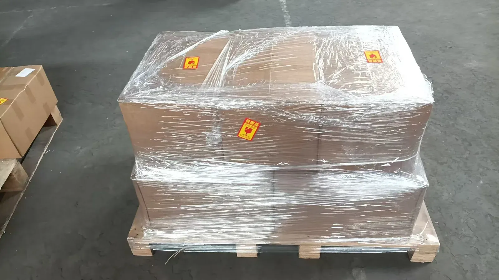 Wancome cast iron cookware shipment wrapped on a pallet and ready for export