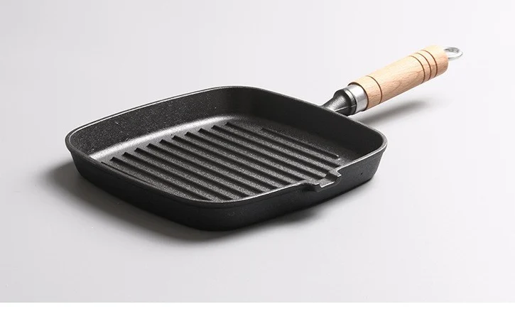 Square cast iron steak pan with one pour spout and wooden handle