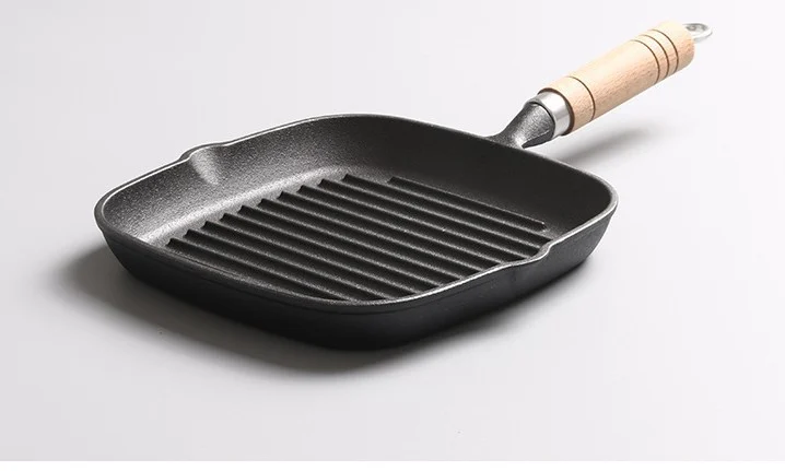 Square cast iron steak pan with two pour spouts and wooden handle