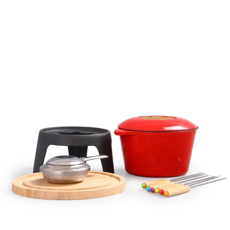 Red enameled cast iron fondue pot with stand, burner and wooden base