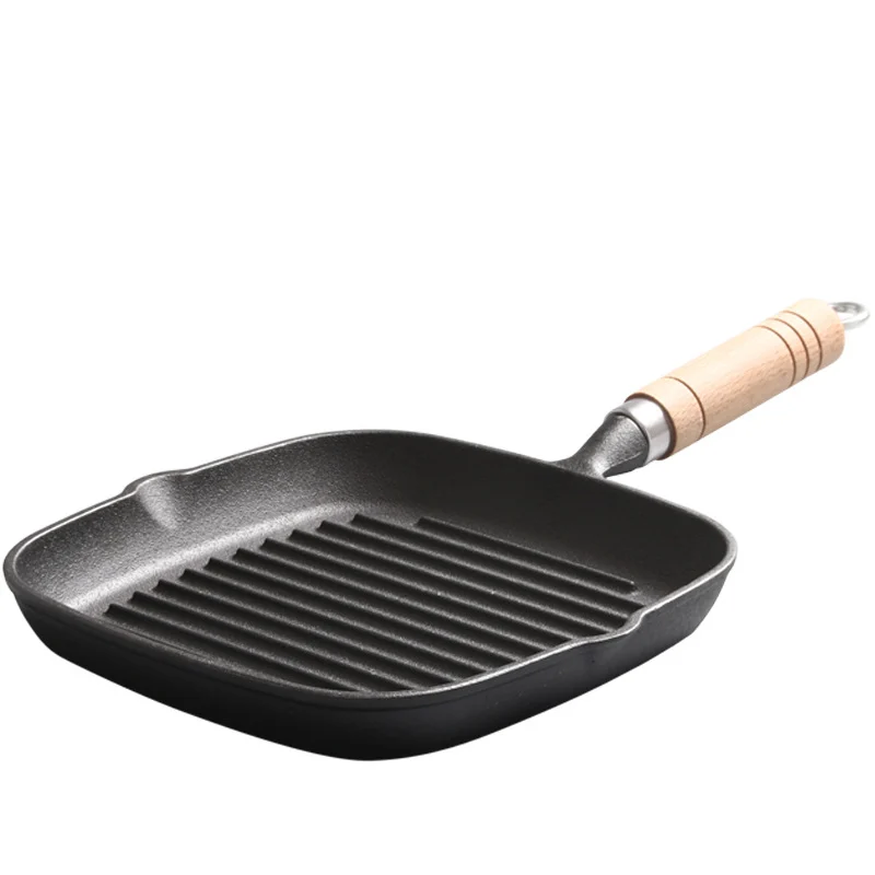 Ribbed square cast iron steak pan with wooden handle, angled view