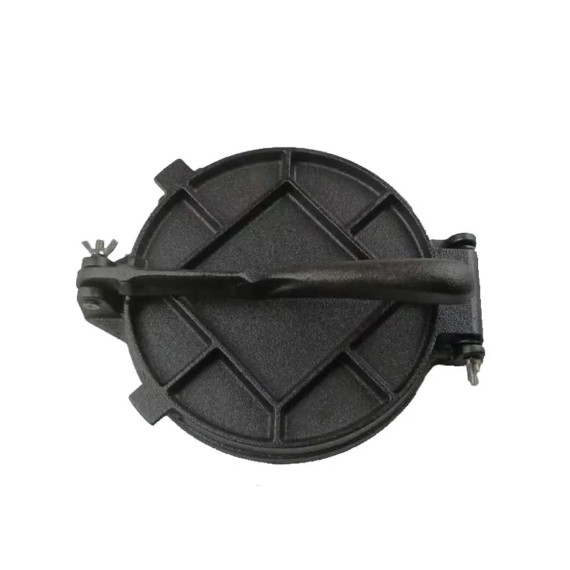 Back of round cast iron waffle maker