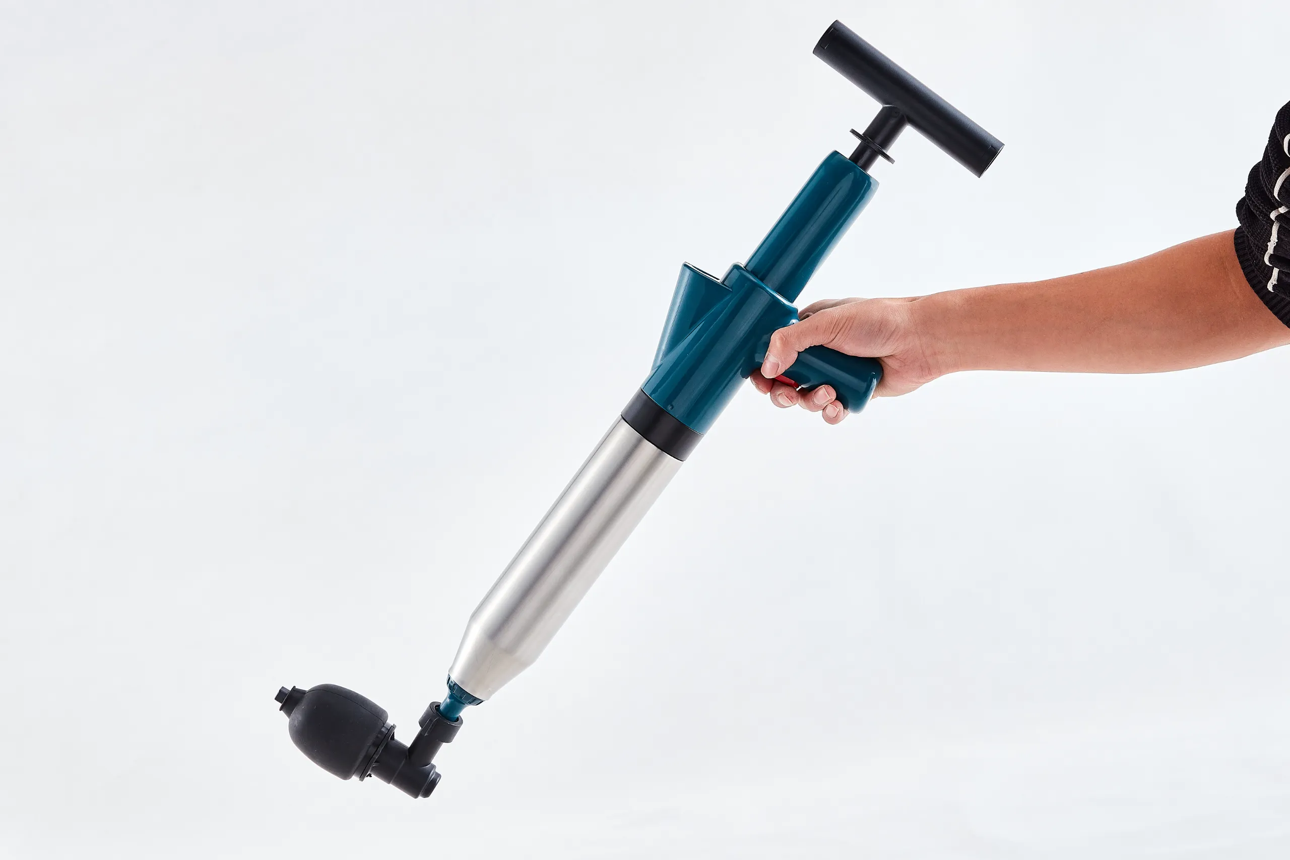 WC-P009 manual drain cleaner held in an operating position